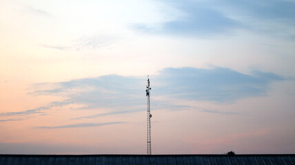 mobile phone tower in sunrise