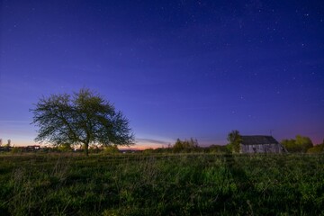 Tranquil Night Sky Over Rural Farmland With Tree And Barn In Foreground © Ya