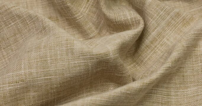 Beige fabric background. Beige cloth waves background texture. Beige fabric cloth textile material.