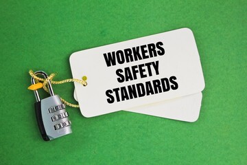 key and paper tag with the words workers safety standards. the concept of safety in the workplace.