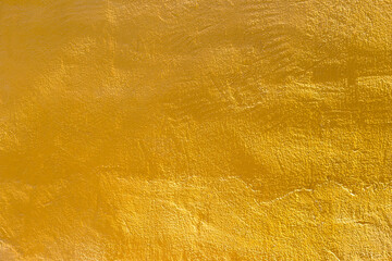 Yellow cement wall with morning day light background, blank yellow concrete wall texture background