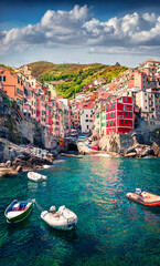 Vertical virew of first city of Cique Terre sequence of hill cities - Riomaggiore. Bright morning...