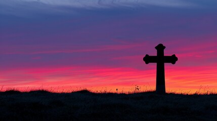 Silhouette of a Christian cross against the backdrop of a colorful sunset with faith, religion, hope concept