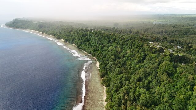 Approaching rain above the coastline of Buka.