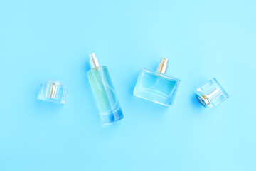 Perfume bottle on blue background, Glass bottle of perfumery