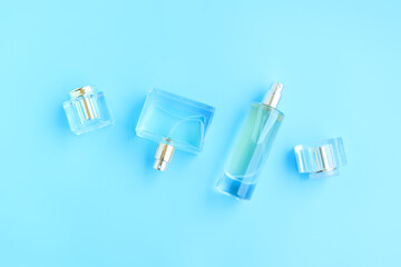 Perfume bottle on blue background, Glass bottle of perfumery