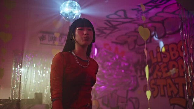 Trendy hipster dancing night club with expressive emotion closeup. Joyous woman