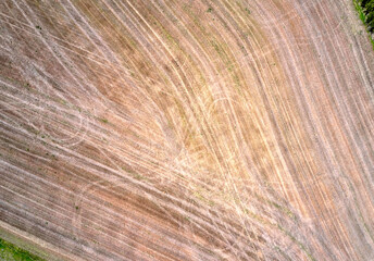 Naklejka premium Aerial view and the texture of the ploughed field in the countryside