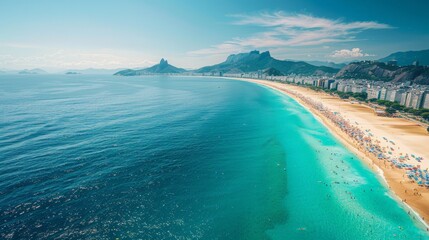 Aerial view of the Copacabana Beach in Rio de Janeiro, Brazil, showcasing the iconic beach, clear blue waters, and vibrant cityscape.     