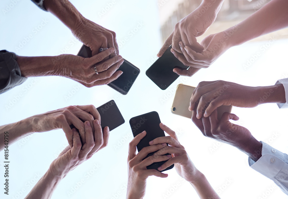 Poster Group, low angle and hands with smartphone in networking, social media and online, digital and application. Team, people and below, tech and connection for communication, information and business
