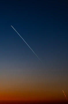 April 2024 Rocket Launch from Vandenburg Air Force Base Captured at Huntington Beach, California, USA-no people, vertical