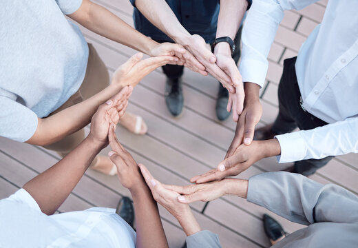 People, business and hands in circle for teamwork in day for solidarity, support and diversity in workplace. Team building, huddle and global collaboration for international company, trust and above