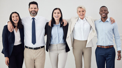 Obraz premium Group, people and smile in portrait with hug at workplace in unity as colleagues in white background. Diversity, community and support at company in collaboration with confidence or pride at office
