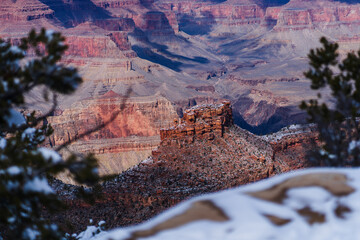 Winter's Embrace on Grand Canyon Rocks with Snow-Dusted Foreground