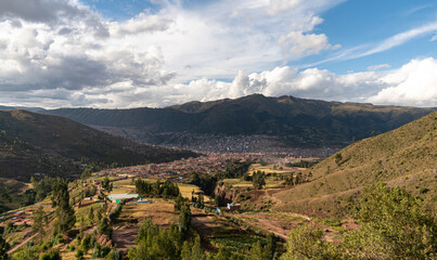 a distant city and mountains in the background