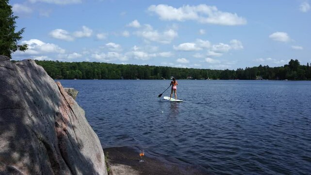Serene Paddle Boarding Session on a Sunny Day in Magnetawan, Ontario