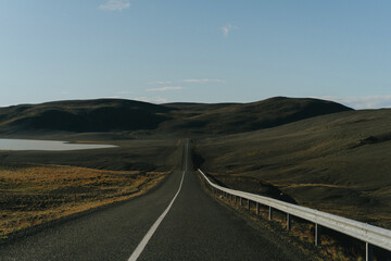 Iceland road view in a sunny autumn day.