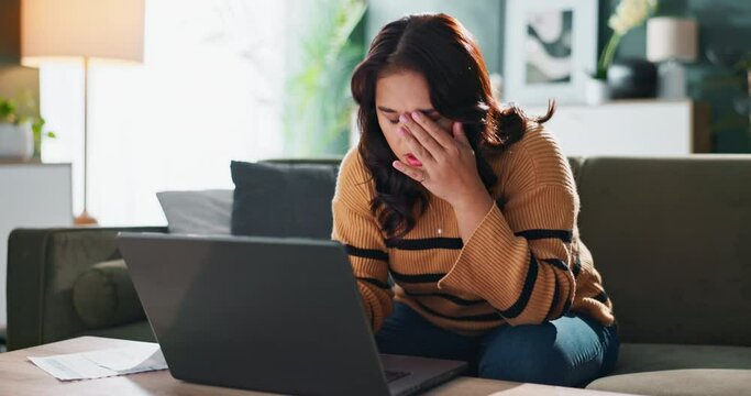 Problem, paper and woman on couch with laptop for internet error, online spreadsheet and budget fail. Computer, document and accountant girl at home for remote work with audit mistake and tax bills