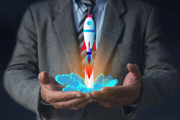 Businessman hands holding rocket icon, Rocketing take off with a targeted launch speed, Wealth fast