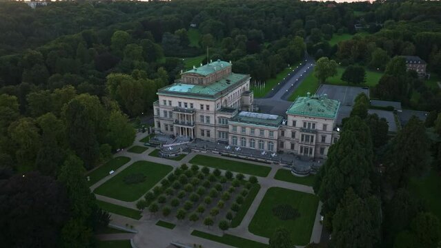 Aerial drone view of Villa H&uuml;gel in Essen, Germany. The Villa H&uuml;gel is a 19th-century mansion located in the Bredeney district, now part of Essen. A beautiful castle on the mountainside .