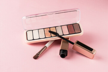 Close up of eyes make up set,multicolour eyeshadow palette, professional brush and eyelashes...