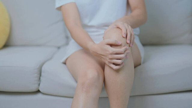 woman having knee ache and muscle pain due to Runners Knee or Patellofemoral Pain Syndrome, osteoarthritis, arthritis, rheumatism and Patellar Tendinitis. medical concept