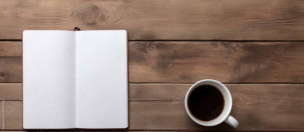 Poster A copy space image of a notebook styled with a tablet and coffee placed on a wooden surface
