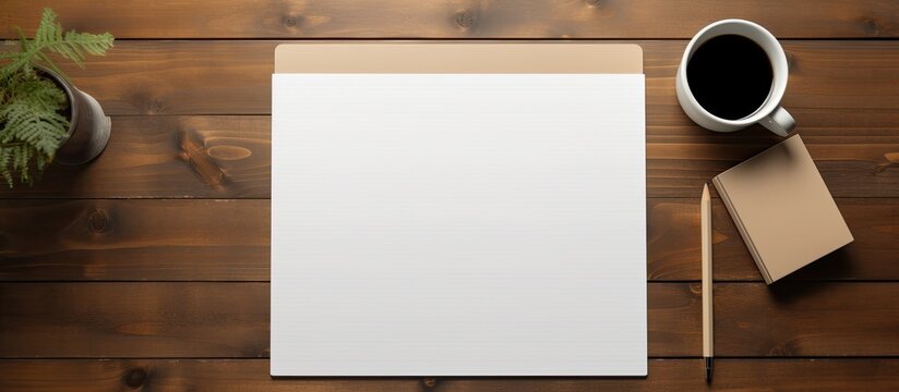 The artist s home office desk is adorned with a clipboard tablet pad featuring a blank paper sheet creating a spacious and inviting workspace This top down view mockup provides ample copy space for c