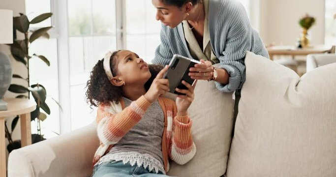 Mother, child fight and phone addiction on sofa for electronics limit, mobile regulation and discipline at home. Upset, girl and strict mama with smartphone overuse for social media problem on couch