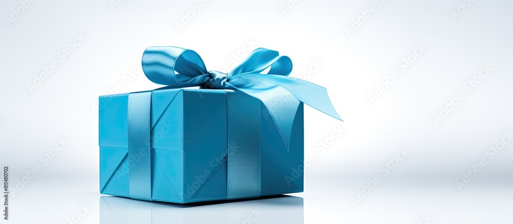 Poster A blue gift box is seen alone on a white background with empty space around it for adding images or text. Creative banner. Copyspace image