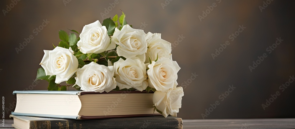 Poster A stack of books with beautiful white roses on top creating a lovely composition for a copy space image