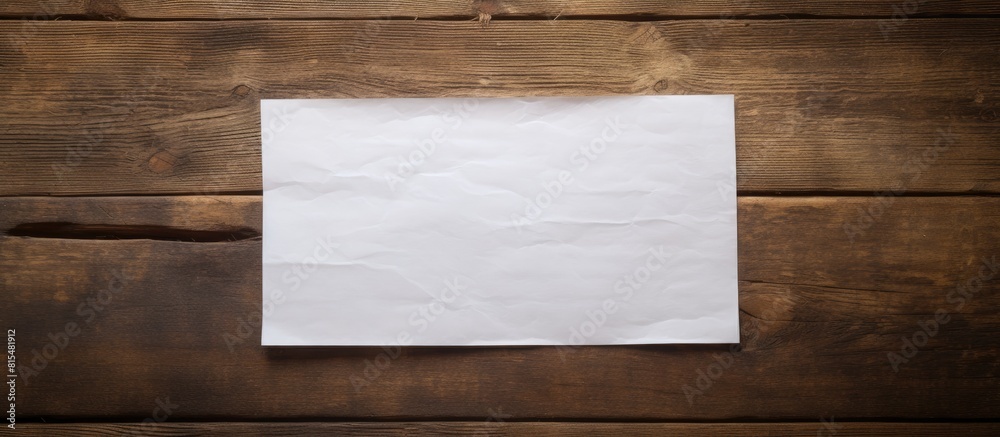 Poster An image of note paper on an aged wooden table with ample copy space