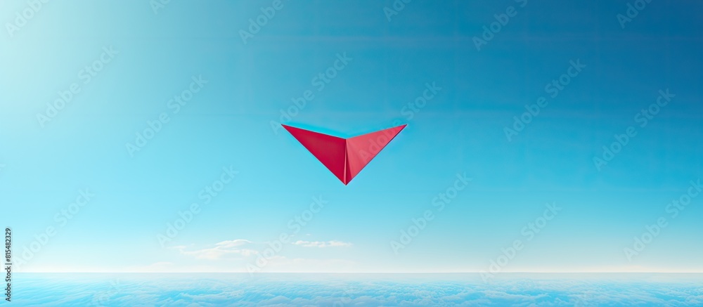 Poster a panoramic shot captures a leadership concept with a top view of a red paper plane on a blue backgr