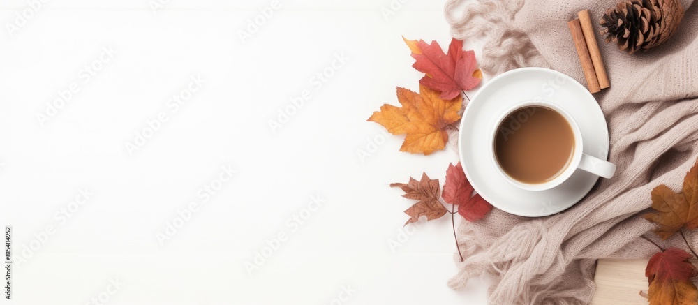 Aufkleber a cozy autumn home composition with dried leaves a cup of coffee a book a scarf and flowers on a whi