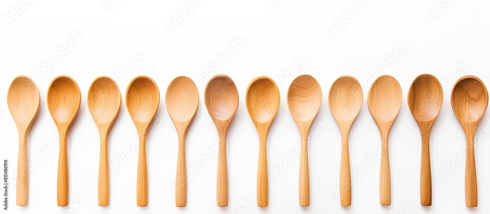 Poster A simple and clean image showcasing wooden spoons on a white background with plenty of copy space