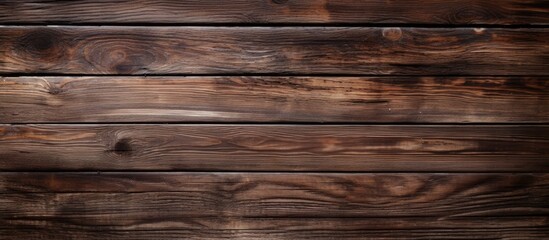 Naklejka premium An aged dark brown wooden background with a rustic appearance creating a vintage ambiance Ample copy space for images