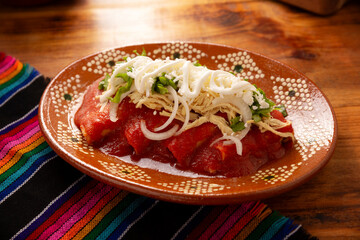 Entomatadas. Also known as Enjitomatadas, a typical dish of Mexican cuisine prepared with corn...
