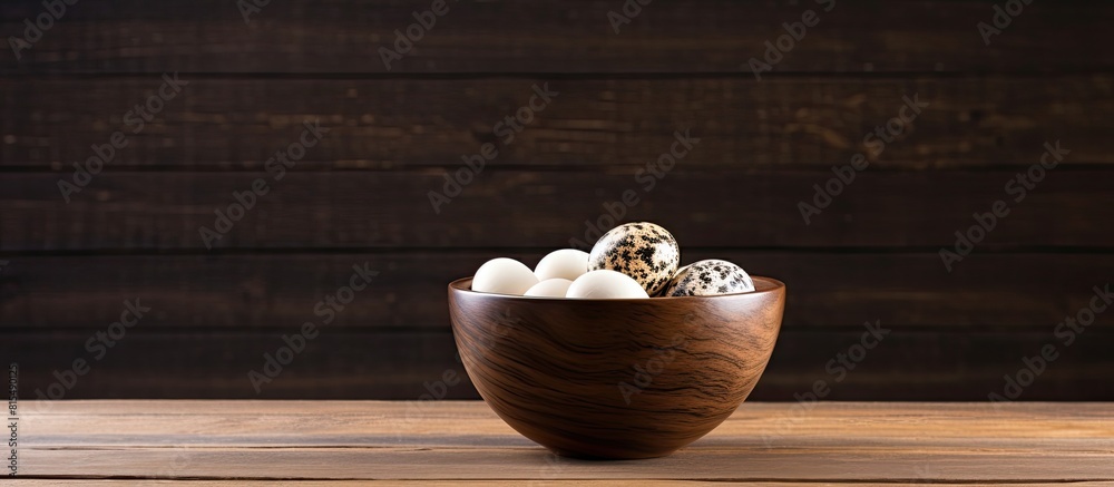 Poster a quail egg is placed in a bowl on a wooden table providing an ample amount of copy space for text o