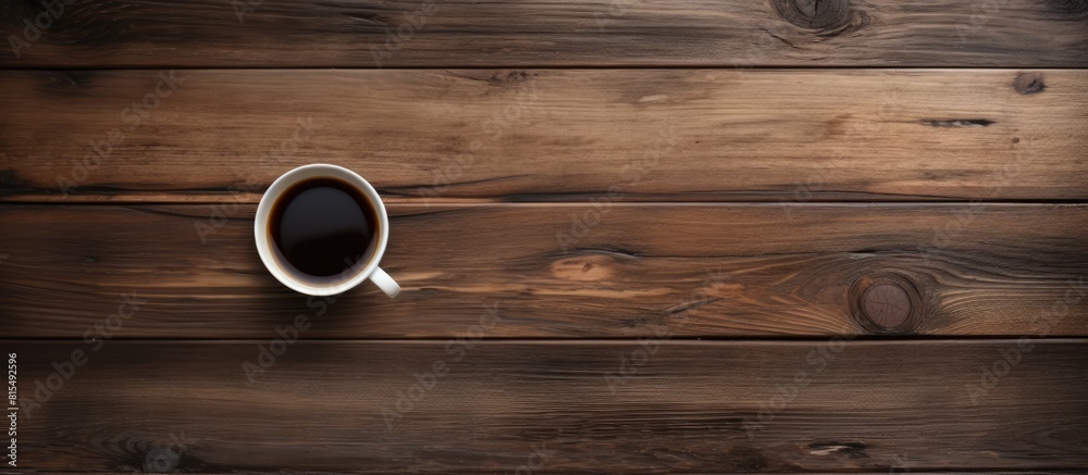 Aufkleber A top down perspective showing an old wooden surface with a cup of black coffee perfect for a copy space image 108 characters