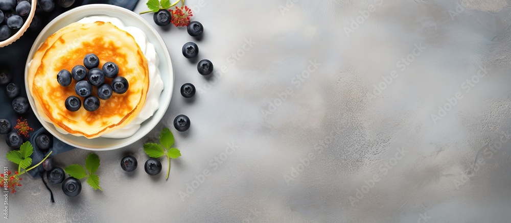 Poster top view of a copy space image featuring light background with cottage cheese pancakes sour cream an