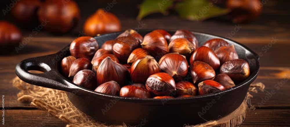 Aufkleber Chestnuts perfectly roasted and served in a rustic chestnut pan rest on a vintage table creating a charming copy space image