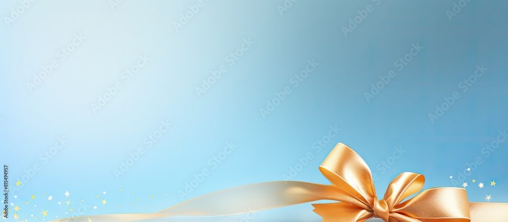 Poster light blue background adorned with a beautiful golden ribbon leaving ample copy space for text