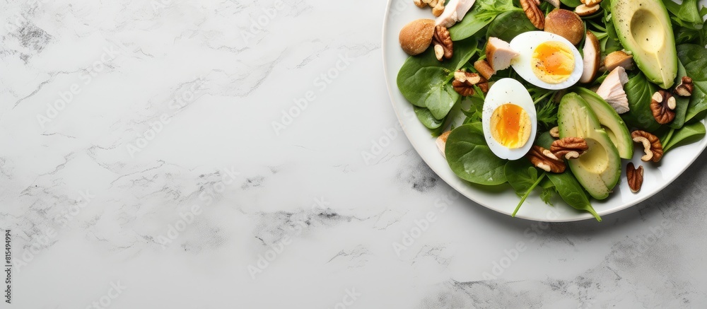 Poster copy space image of a keto friendly meal consisting of avocado slices grilled chicken quail eggs spi