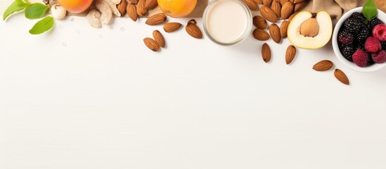 A top down copy space image of a beige table with an almond frame showcasing healthy food