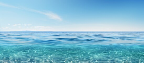 Obraz premium A serene image of the ocean with vast stretches of crystal clear water perfect for using as a copy space image