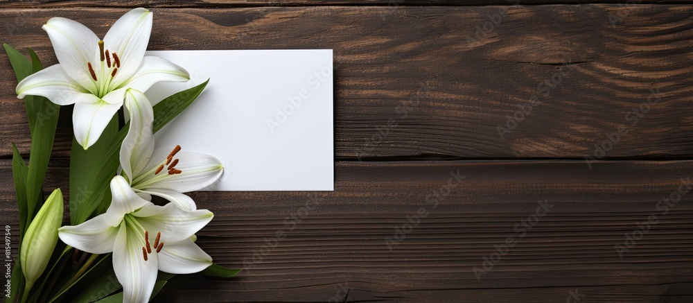 Poster a copy space image of a white greeting card and craft envelope adorned with lilies flowers placed on