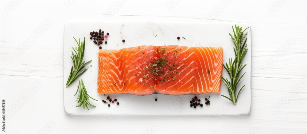 Poster a top down view of a raw salmon fillet seasoned with sea salt and rosemary placed on a white table w