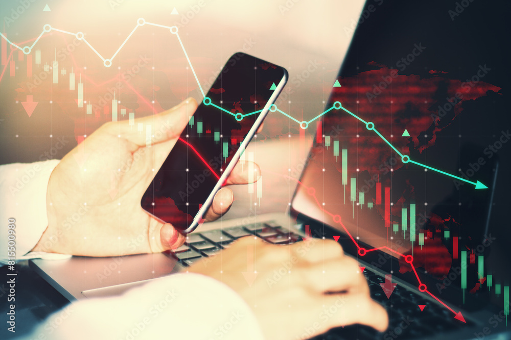 Poster Side view of male hands using smartphone and laptop keyboard at desk with falling red forex chart and map on blurry background. Trade and crisis concept. Double exposure.