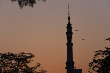 silhouette of mosque in sunset