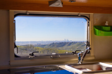 Skyline of the city of Madrid (Spain) seen from the window of a motorhome